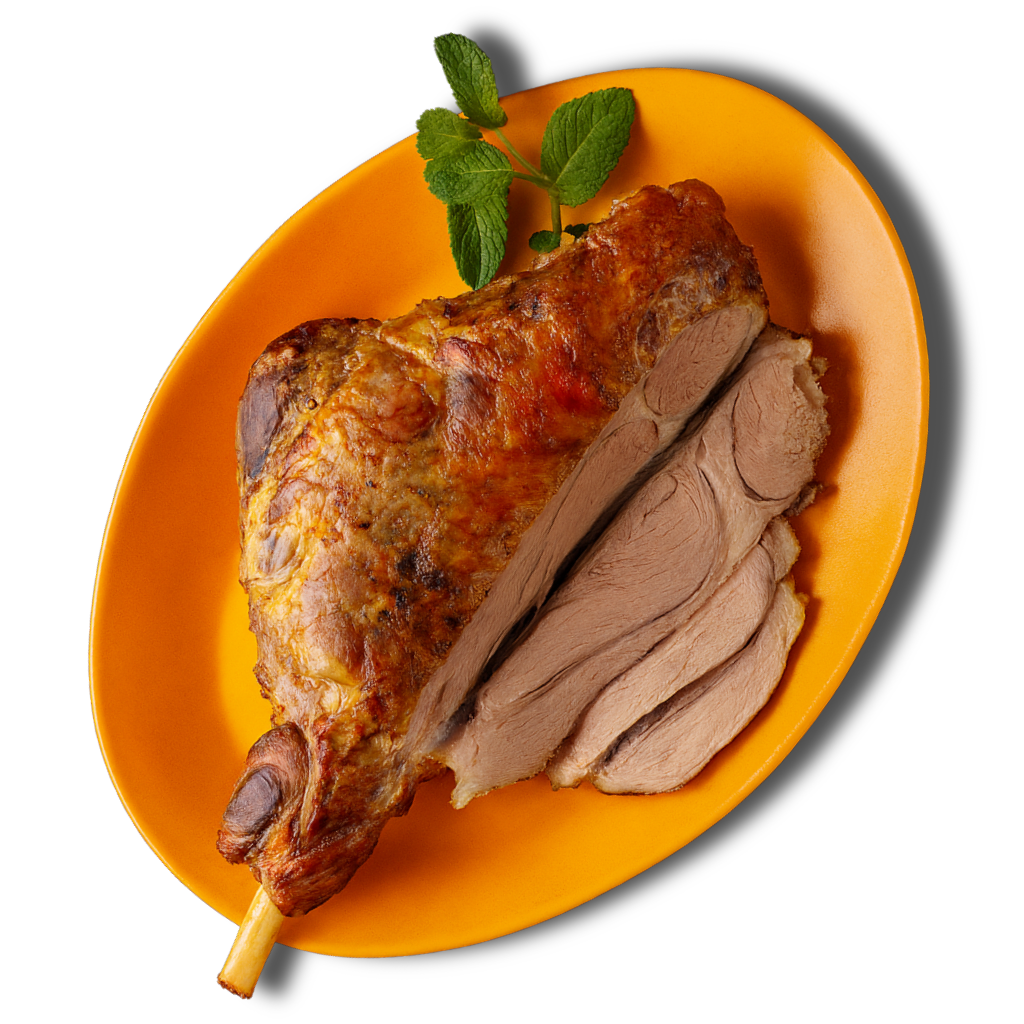 Prime Range Fresh Roast lamb on an orange plate with a sprig of mint