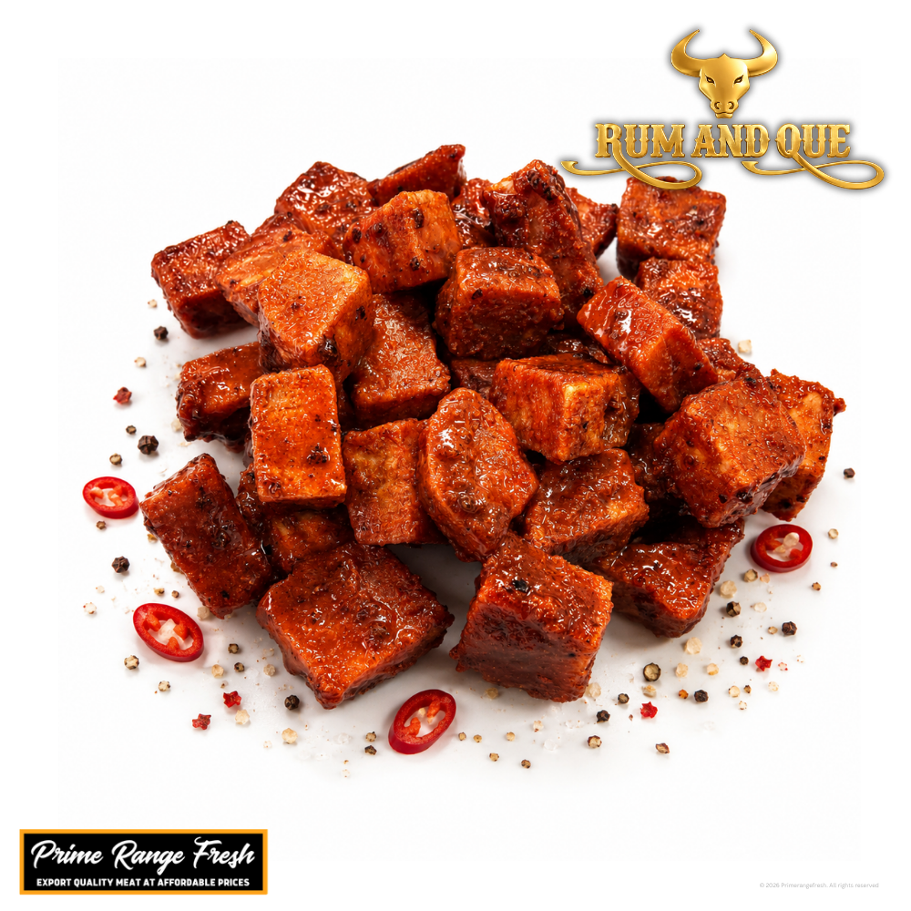 Spiced cubes of meat with red peppers on a white background, featuring the Rum and Que logo.