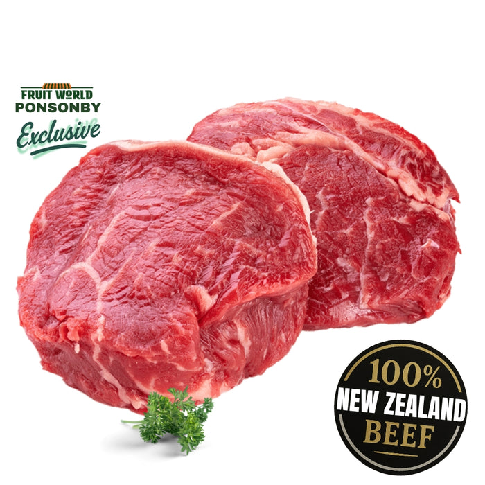 Two raw beef steaks with '100% New Zealand Beef' label on a white background.