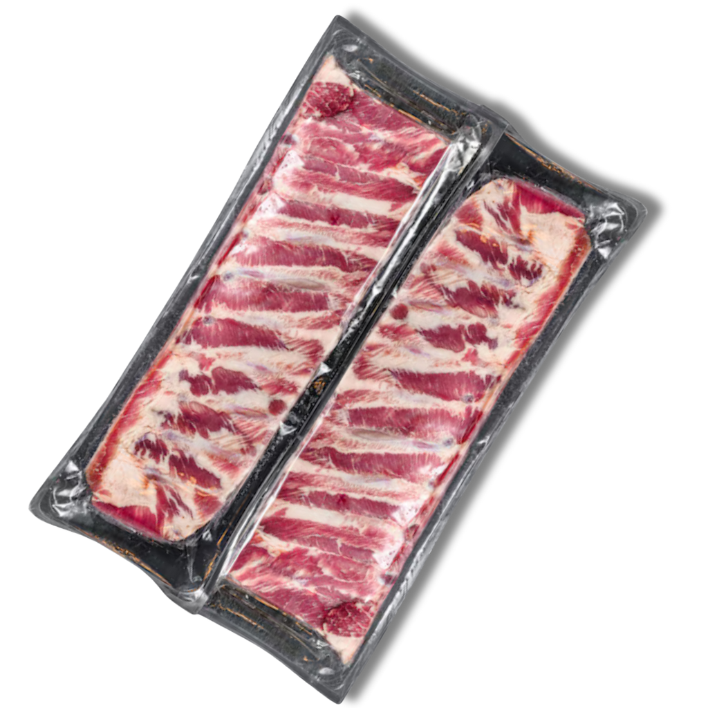 Packaged raw Pork ribs on a white background