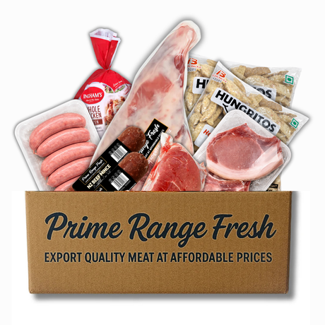 Box of Prime Range Fresh meat products including sausages, ham, and other packaged meats on a white background.